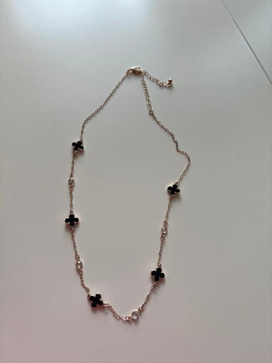 black with gold necklace